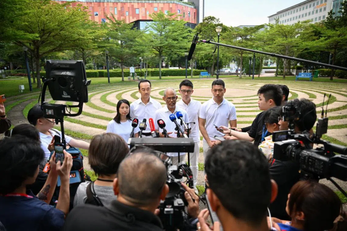 Minister-in-charge of Muslim Affairs Masagos Zulkifli (centre) with members of the PAP Tampines GRC team in Tampines Avenue 4 on April 26.