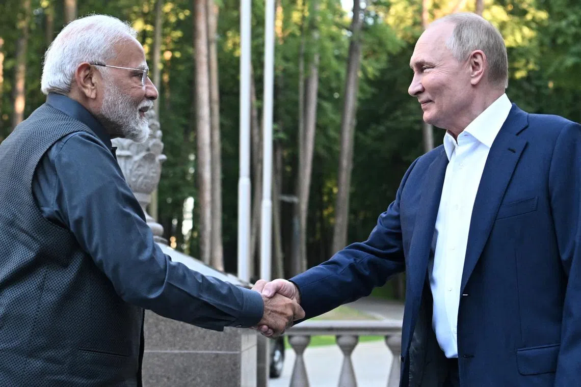 Russia's President Vladimir Putin shakes hands with India's Prime Minister Narendra Modi during their meeting at the Novo-Ogaryovo state residence near Moscow, Russia July 8, 2024. Sputnik/Sergei Bobylyov/Pool via REUTERS/ File Photo