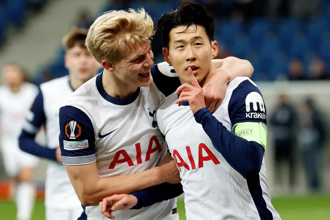 Tottenham Hotspur's Son Heung-min celebrates scoring their third goal with Lucas Bergvall.     