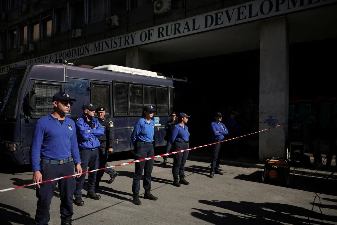 FILE PHOTO: Police protects the Ministry of Rural Development and Food, during farmers’ protest over delays to EU subsidies due to farm fraud scandal, in Athens, Greece, November 11, 2025. REUTERS/Louisa Gouliamaki/File Photo