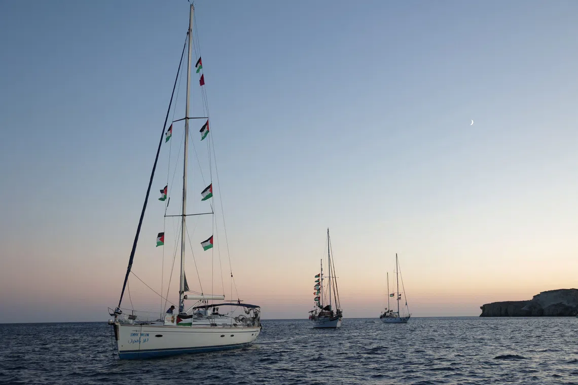 Sailing boats, part of the Global Sumud Flotilla aiming to reach Gaza and break Israel's naval blockade, sail off  Koufonisi islet, Greece, September 26, 2025. REUTERS/Stefanos Rapanis