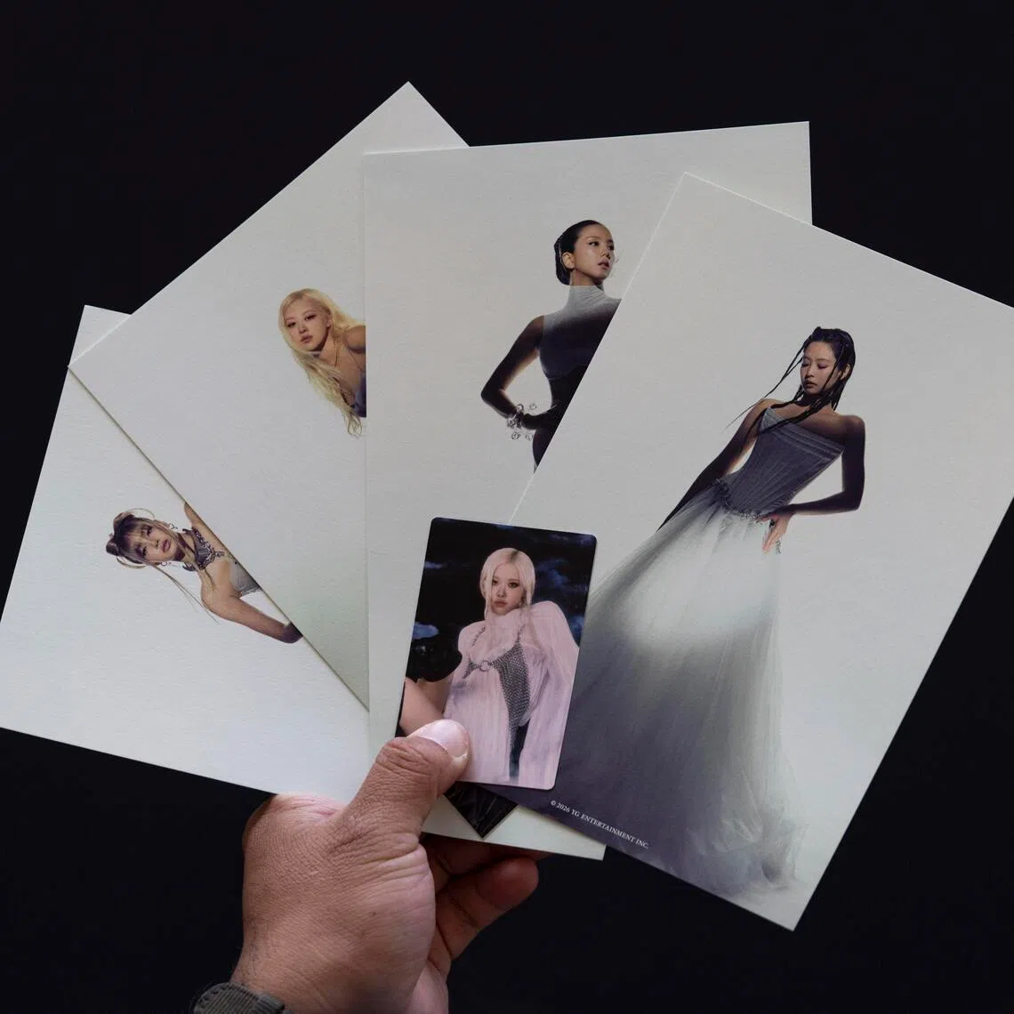 A fan holds postcards of Blackpink's Deadline release at the National Museum of Korea in Seoul, South Korea on Feb 27, 2026. 