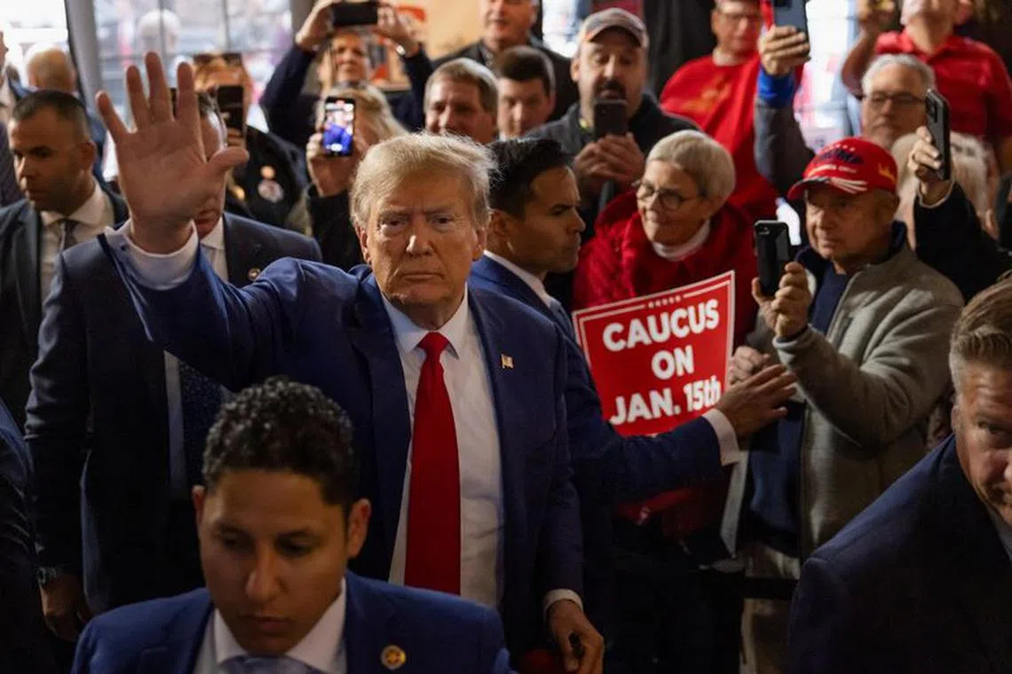 FILE PHOTO: Former U.S. President and Republican presidential candidate Donald Trump rallies with supporters at a \"commit to caucus\" event at a Whiskey bar in Ankeny, Iowa, U.S. December 2, 2023. REUTERS/Carlos Barria/File photo