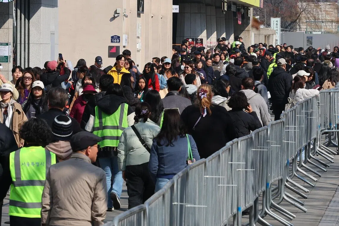 BTS fans gathering around a stage at Gwanghwamun Square in Seoul on March 21.