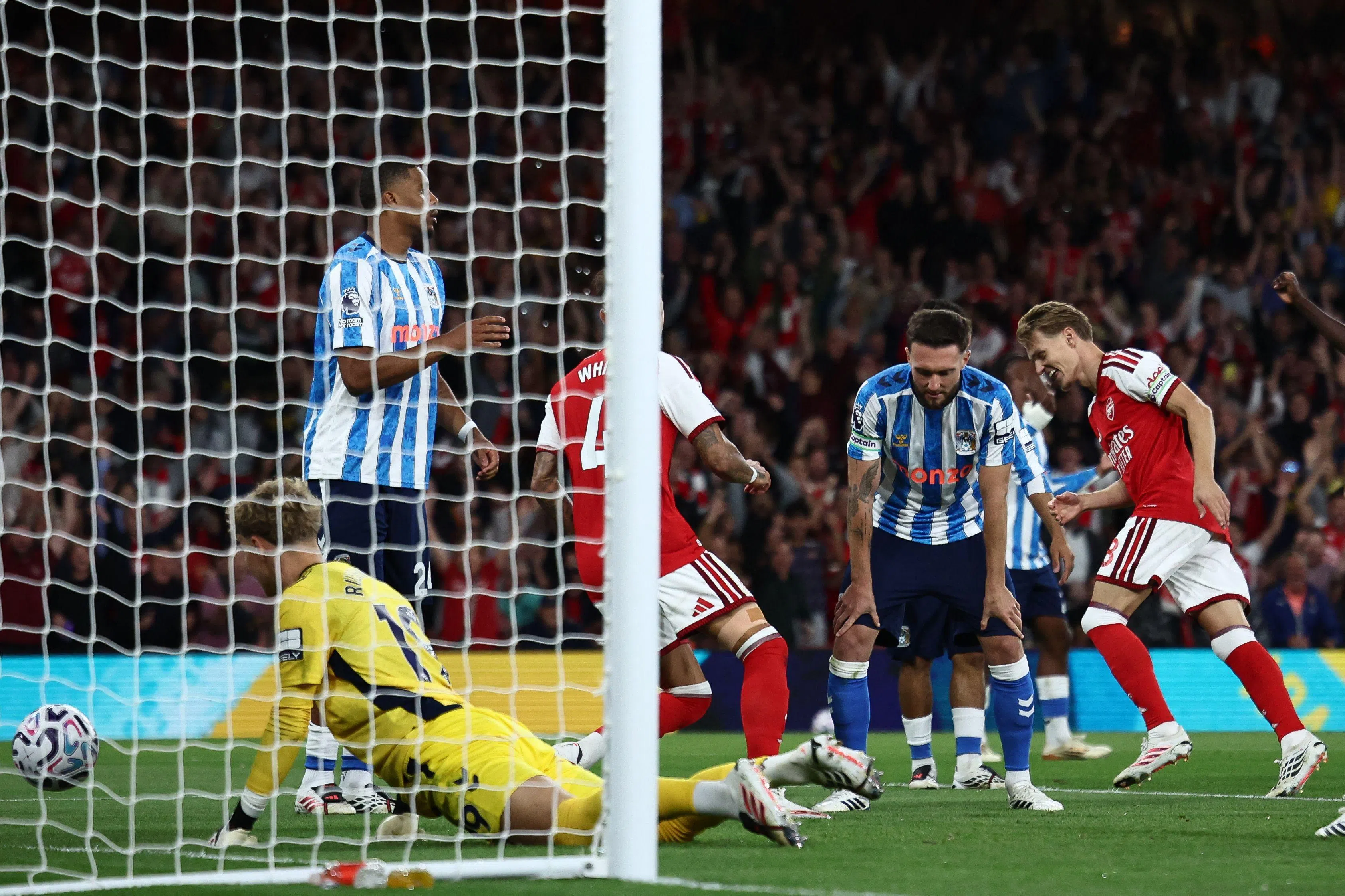 Midfielder Martin Odegaard celebrates scoring Arsenal’s third goal.