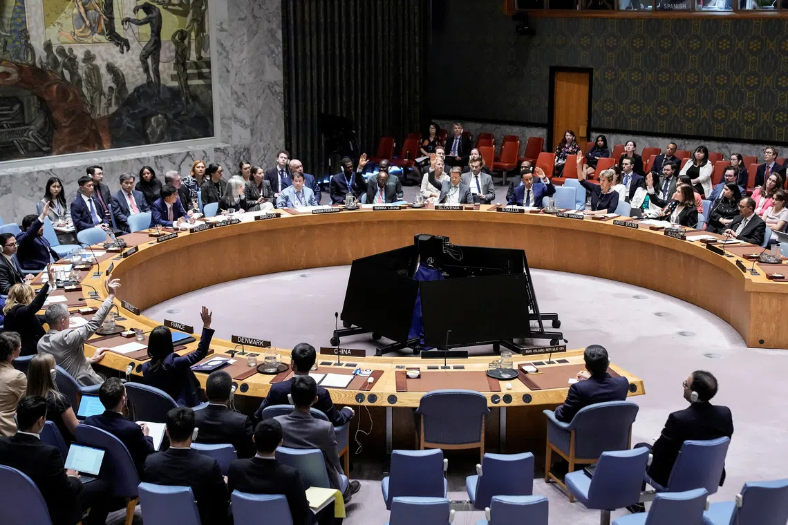 FILE PHOTO: Members of the United Nations Security Council vote against a resolution by Russia and China to delay by six months the reimposition of sanctions on Iran during the 80th U.N. General Assembly in New York City, U.S., September 26, 2025. REUTERS/Eduardo Munoz/File Photo