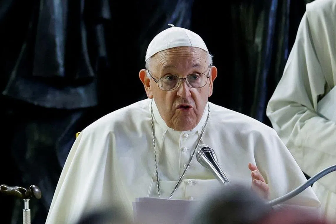 FILE PHOTO: Pope Francis holds prayer for migrants and refugees, with the 'Angels Unaware' monument, dedicated to the world's migrants and refugees, behind him in St. Peter's Square, at the Vatican, October 19, 2023. REUTERS/Remo Casilli//File Photo
