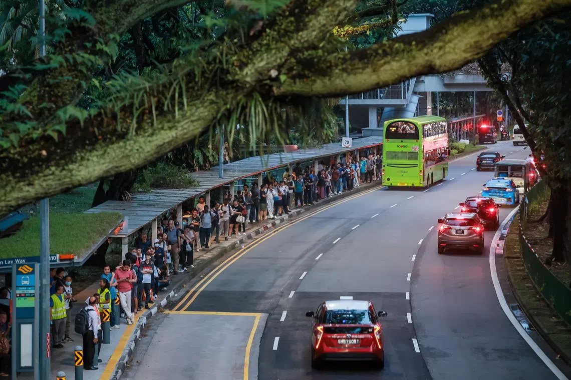 Commuters queueing to board free bridging service buses near Jurong East MRT Station, at 6.55pm on Sept 25, 2024. 