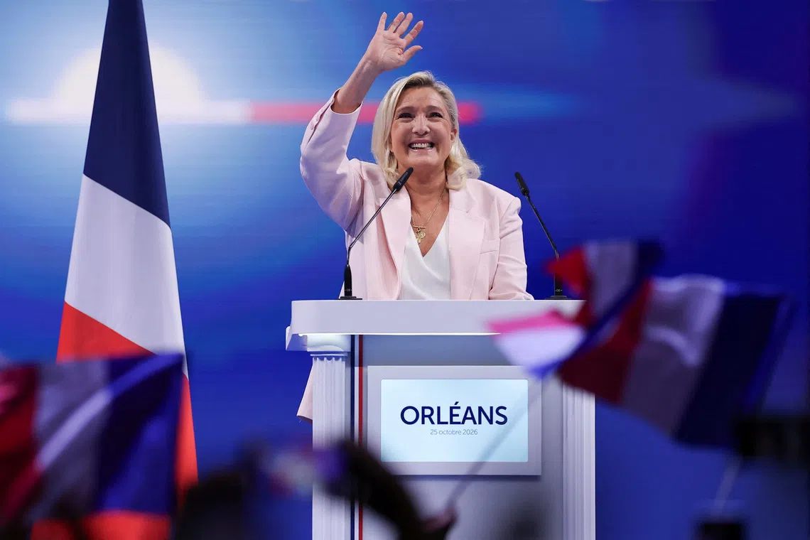French far-right leader Marine Le Pen delivers a speech during a political rally to launch her presidential campaign, after the party’s congress on Oct 25 in Orleans, France.