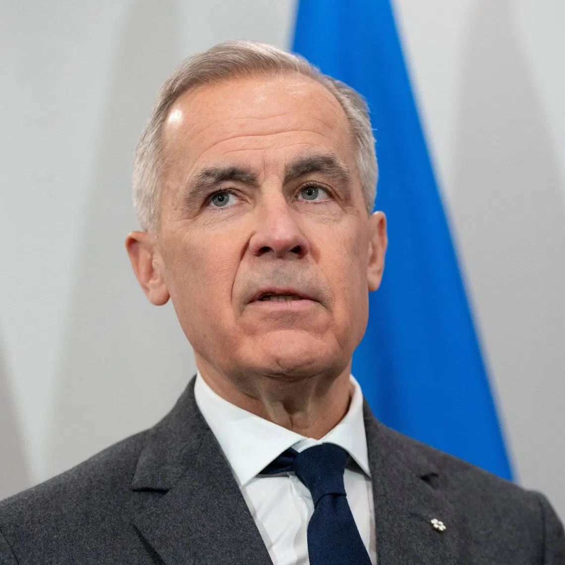 FILE PHOTO: Canada's Prime Minister Mark Carney looks on during his meeting with Ukrainian President Volodymyr Zelenskiy in Halifax, Nova Scotia, Canada, December 27, 2025. REUTERS/Darren Calabrese/File Photo