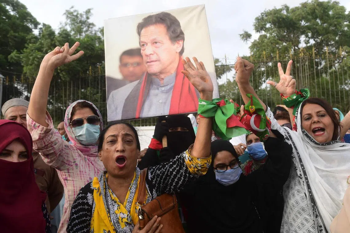 Pakistan Tehreek-e-Insaf (PTI) party activists and supporters protesting against the arrest of Pakistan's former Prime Minister Imran Khan in Karachi on Sunday. 