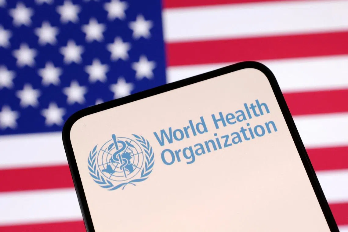 World Health Organization (WHO) logo and U.S. flag are seen in this illustration taken April 23, 2025. REUTERS/Dado Ruvic/Illustration/File Photo