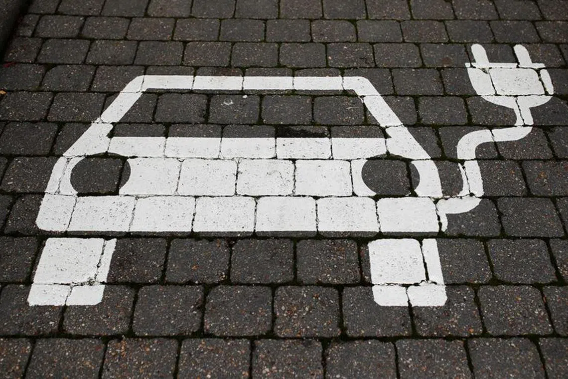 FILE PHOTO: A parking sign for electric vehicles is pictured, where U.S. electric vehicle pioneer Tesla announced to build its first European factory and design center near Berlin, in Gruenheide, Germany, November 13, 2019. REUTERS/Hannibal Hanschke/File Photo