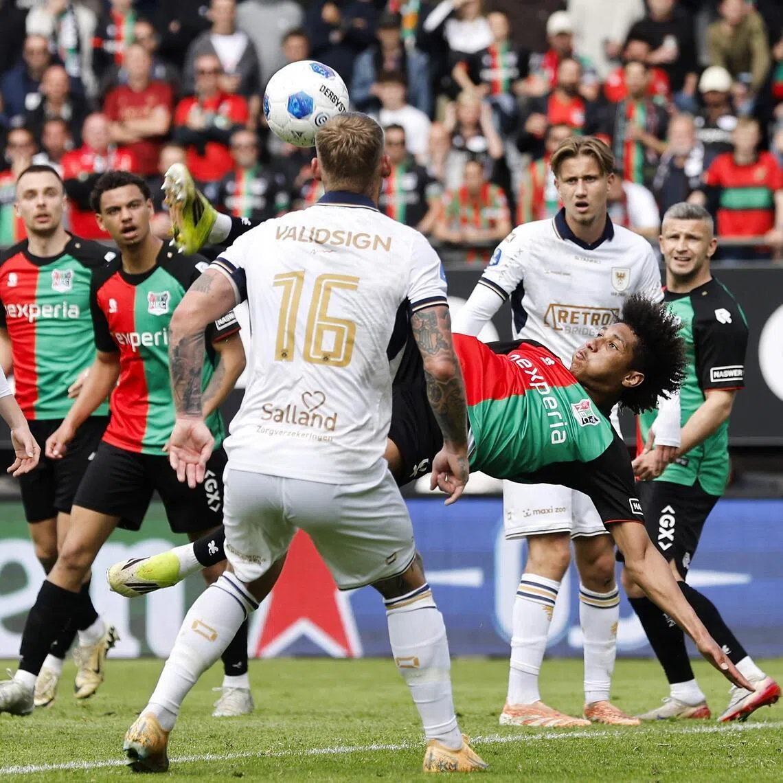 NEC Nijmegen's French midfielder Noe Lebreton scores a goal with an overhead kick in the Dutch Eredivisie football match against Go Ahead Eagles at Goffert stadium in Nijmegen on May 17, 2026.