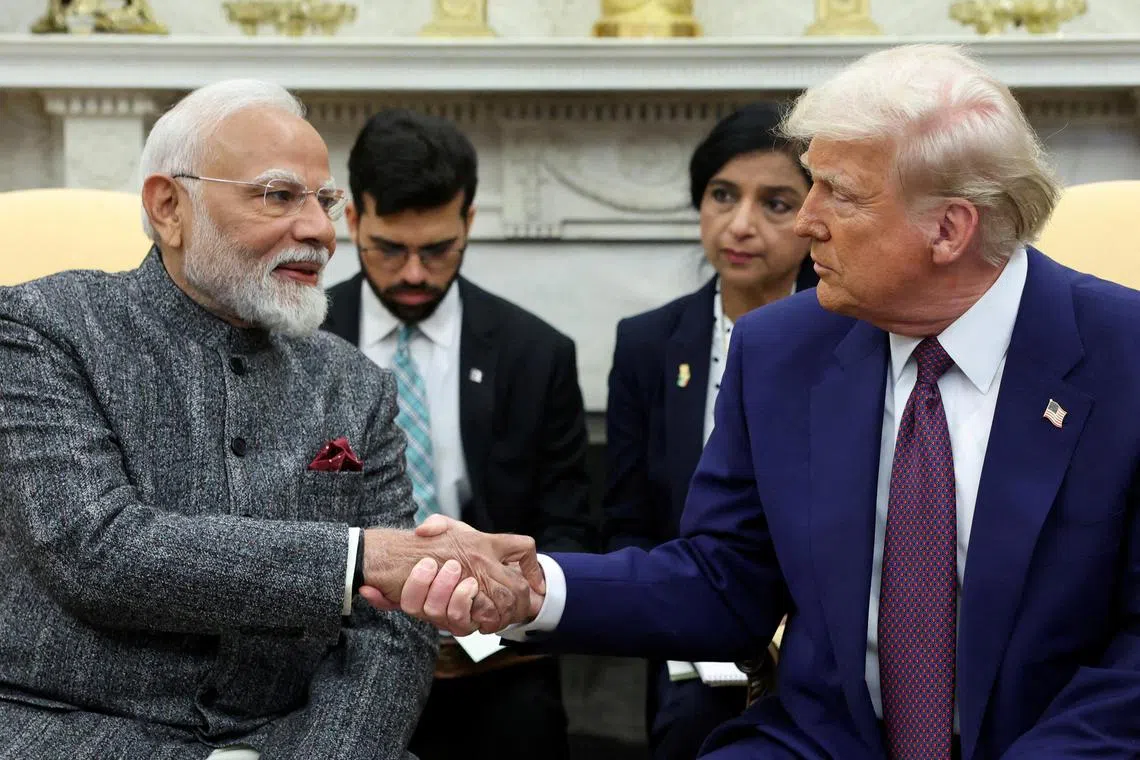 US President Donald Trump and Indian Prime Minister Narendra Modi shake hands at the White House on Feb 13, 2025.