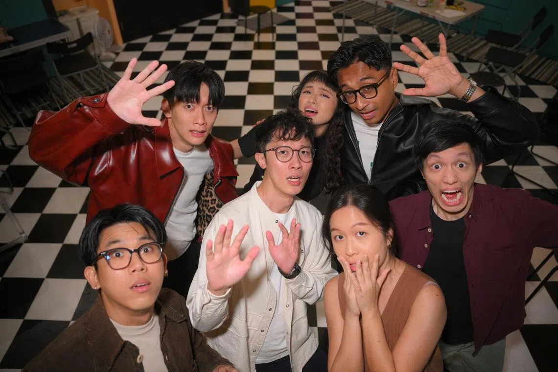 We Can Save The World!!! director Cheng Chai Hong (centre in white), co-producer Martin Loh (bottom left) and producer Lee Yi Jia (bottom right), with some of the cast members (from left), Noah Yap, Xuan Ong, Fauzi Azzhar, and Jun Vinh Teoh, pictured on July 13, 2025.