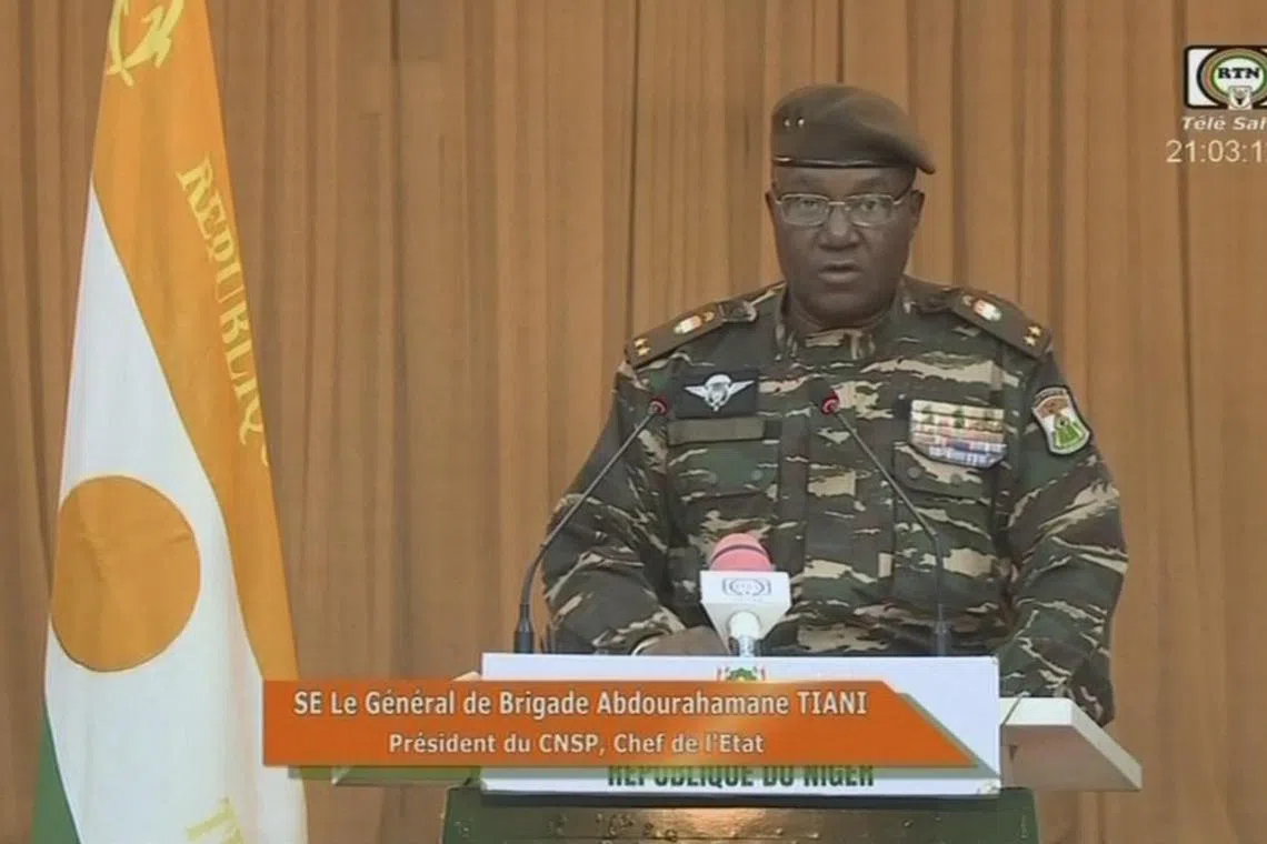 This video frame grab image obtained by AFP from ORTN - Télé Sahel on August 19, 2023 shows Niger's new military ruler General Abdourahamane Tiani, reading a statement on national television. Niger's new military ruler said on August 19, 2023 a transition of power would not go beyond three years, and warned that any attack on the country would not be easy for those involved.
"Our ambition is not to confiscate power," General Abdourahamane Tiani said in a televised address, adding that an attack on Niger would not be "a walk in the park".
His warning came as a delegation from West African bloc ECOWAS arrived in the country for a final diplomatic push before deciding on whether to take military action. (Photo by ORTN - Télé Sahel / AFP) / RESTRICTED TO EDITORIAL USE - MANDATORY CREDIT "AFP PHOTO / ORTN - Télé Sahel  " - NO MARKETING NO ADVERTISING CAMPAIGNS - DISTRIBUTED AS A SERVICE TO CLIENTS