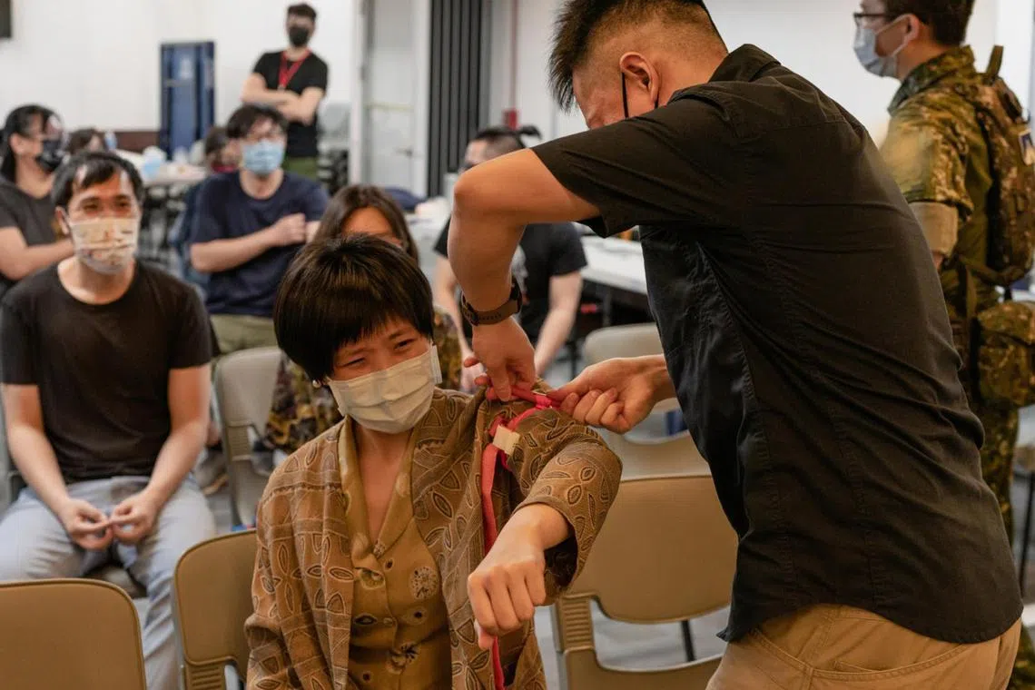 Participants learning first aid at a Kuma Academy course. The non-profit is one of several in Taiwan offering civil defence workshops.