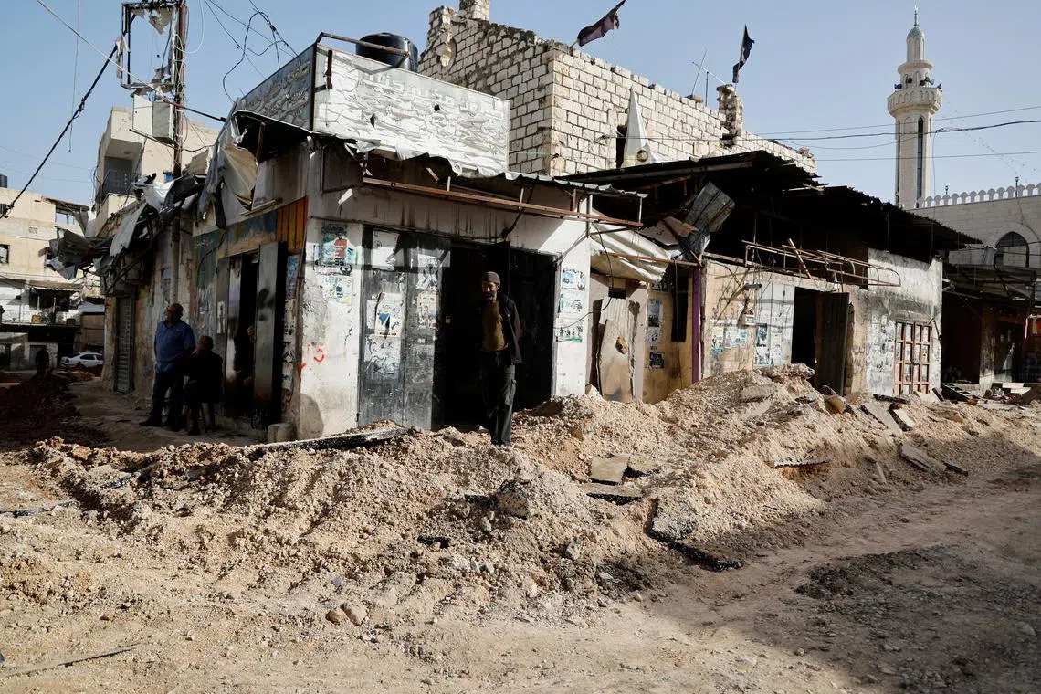 Damage on a street in the aftermath of an Israeli raid in Jenin, in the occupied West Bank, on Nov 26.