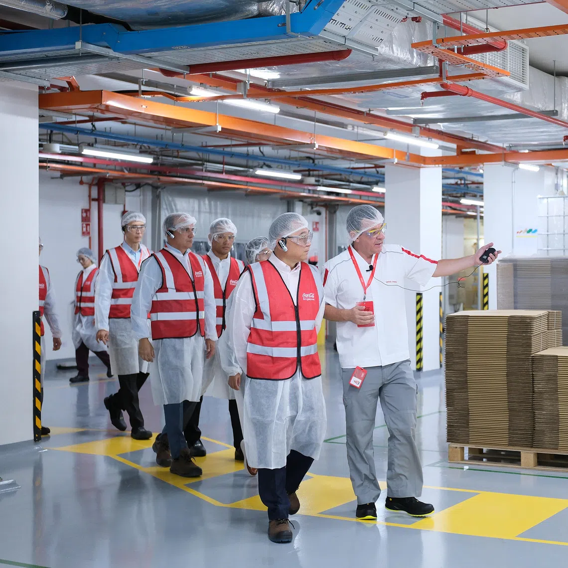 Deputy Prime Minister Gan Kim Yong visits Coca-Cola's regional beverage concentrate plant on Oct 22. 