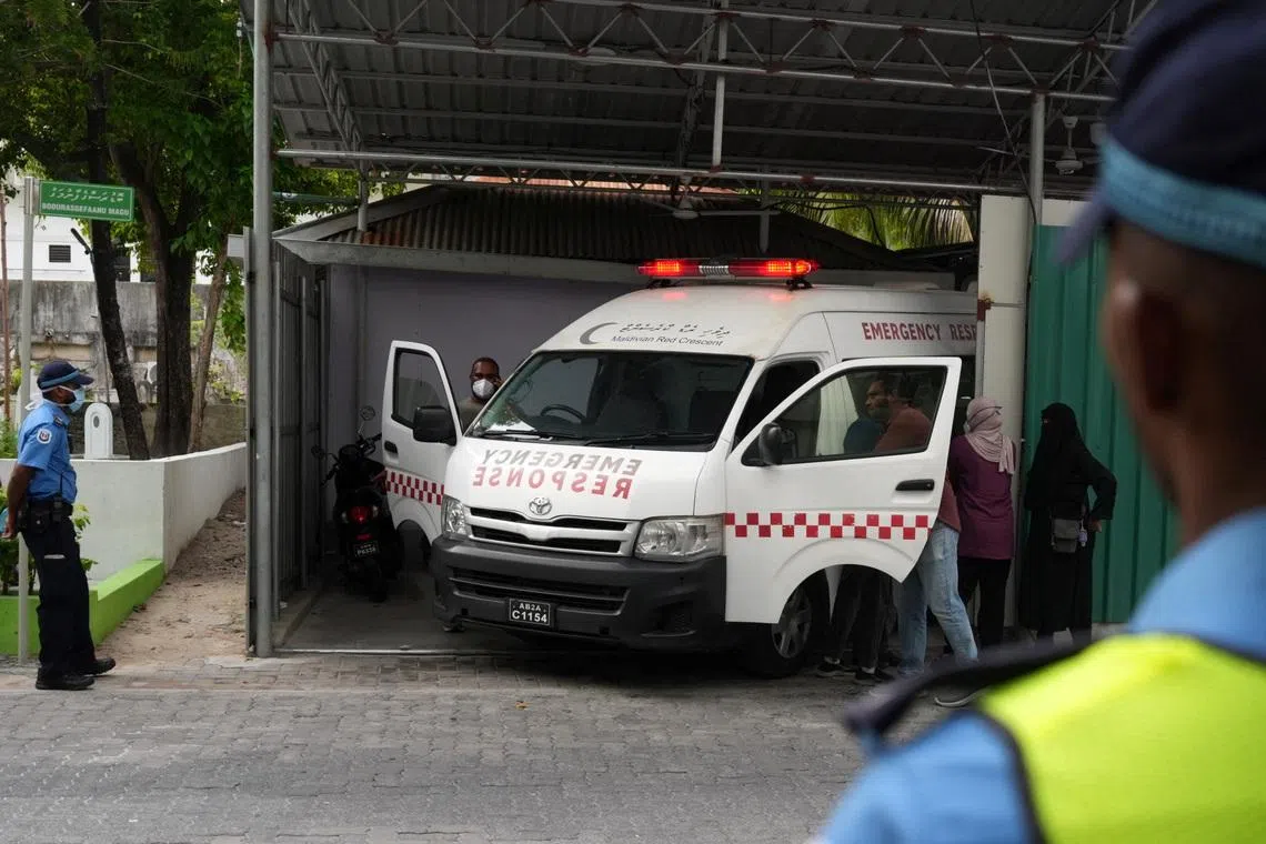 An ambulance carrying the body of one of the five Italian scuba divers who died in an accident in underwater caves, arrives at a mortuary in Male, Maldives, May 19, 2026. REUTERS/Thilina Kaluthotage