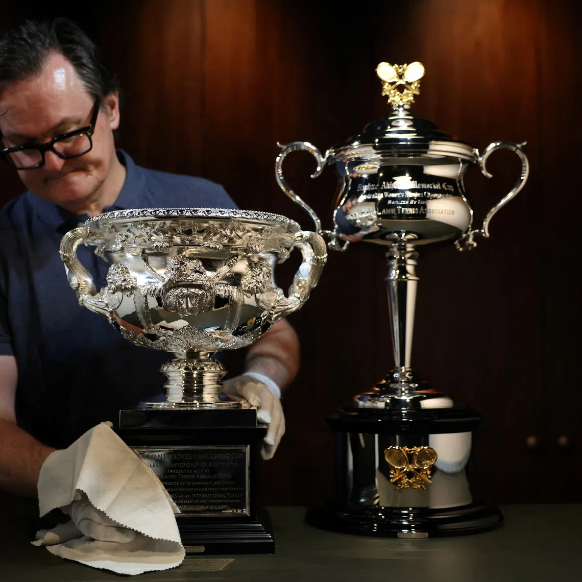 Darren May, General Manager at W.J. Sanders, poses with the Australian Open 2026 Norman Brookes Challenge Cup and Daphne Akhurst Memorial Cup, in Sydney, Australia, December 12, 2025. REUTERS/Hollie Adams