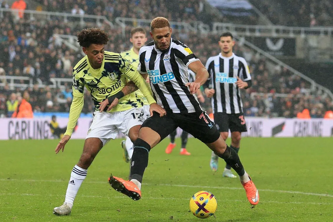 Leeds United midfielder Tyler Adams (left) vies with Newcastle striker Joelinton during the match.