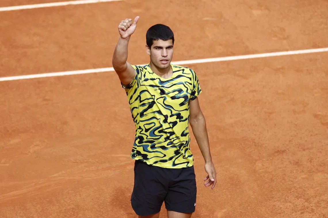Carlos Alcaraz of Spain celebrating after beating Alexander Zverev of Germany in their round of 16 match at the Madrid Open tennis tournament on Tuesday. Alcaraz has emerged as favourite for the French Open after victories on clay at Buenos Aires and Barcelona but the world No. 2 said Rafael Nadal cannot be written off.