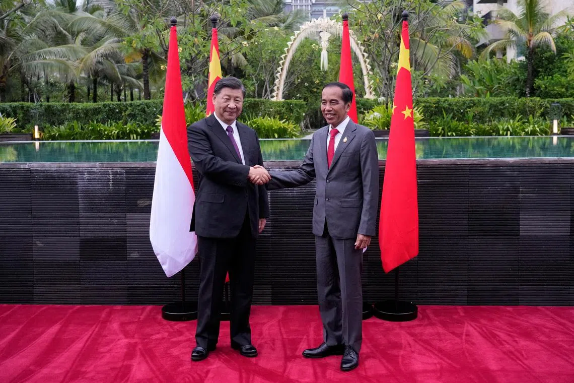Indonesian President Joko Widodo shakes hands with Chinese President Xi Jinping during their bilateral meeting in Nusa Dua, Bali, on Nov 16, 2022. 