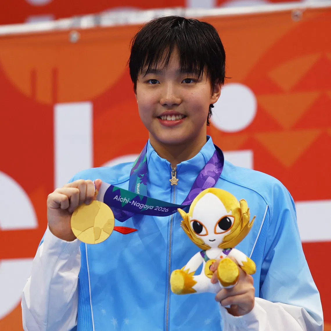 Asian Games - Aichi-Nagoya 2026 - Swimming - Tokyo Aquatics Centre, Koto, Tokyo, Japan - September 23, 2026 Gold medallist China's Zidi Yu celebrates on the podium after winning the Women's 400m Individual Medley Final REUTERS/Manami Yamada