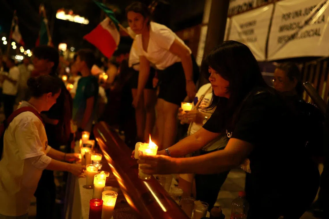 FILE PHOTO: Employees of Mexico's federal judiciary hold candles as they participate in a protest after a highly contested judicial reform proposal was passed in the Senate, in Ciudad Juarez, Mexico, September 11, 2024. REUTERS/Jose Luis Gonzalez/File Photo