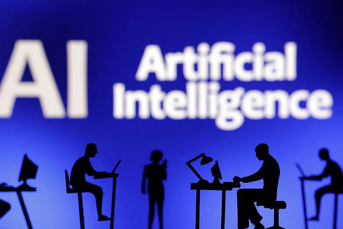 Figurines with computers and smartphones are seen in front of the words "Artificial Intelligence AI" in this illustration taken, February 19, 2024. REUTERS/Dado Ruvic/Illustration