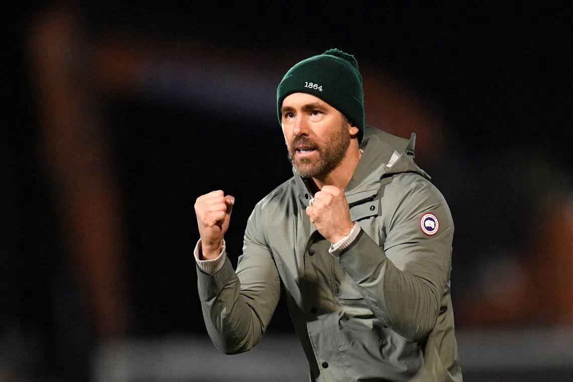 US actor and Wrexham owner Ryan Reynolds acknowledges the fans after the English FA Cup fourth round football match between Wrexham and Sheffield United at the Racecourse Ground Stadium in Wrexham, north Wales, on Jan 29, 2023. The match ended in a draw at 3-3. 