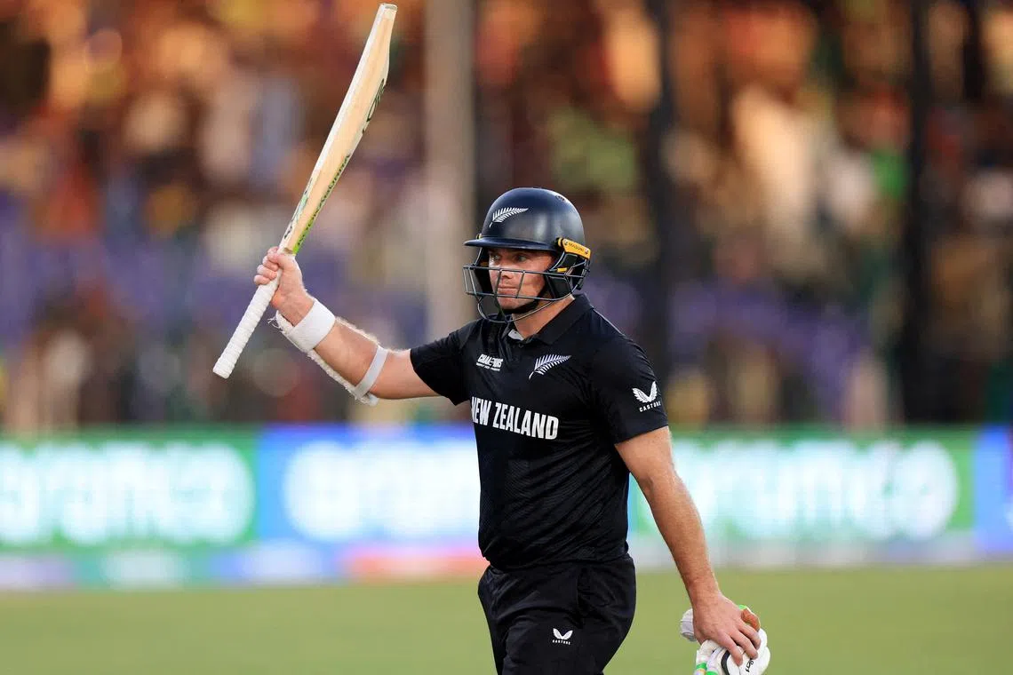 FILE PHOTO: Cricket - ICC Men's Champions Trophy - Group A - Pakistan v New Zealand - National Stadium, Karachi, Pakistan - February 19, 2025 New Zealand's Tom Latham raises his bat to acknowledge the crowd after the end of first innings REUTERS/Akhtar Soomro/File Photo