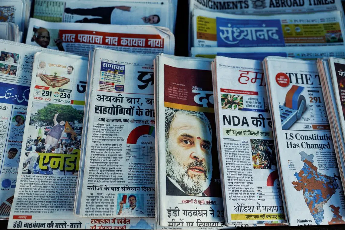 Newspapers are displayed at a stall following the results of India's general election, in Mumbai, India, June 5, 2024. REUTERS/Francis Mascarenhas