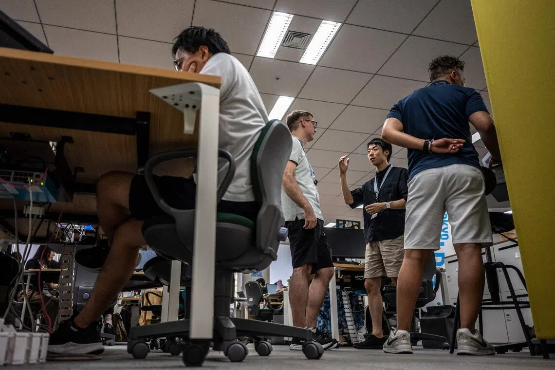 Government officials in casual dress code, including shorts, tee shirts and sneakers as part of the Tokyo’s “Cool Biz” initiative.