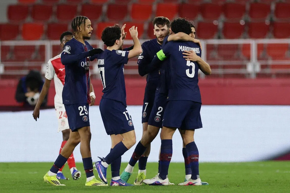 Soccer Football - UEFA Champions League - Play Off - First Leg - AS Monaco v Paris St Germain - Stade Louis II, Monaco - February 17, 2026 Paris St Germain's Achraf Hakimi celebrates scoring their second goal with Marquinhos, Khvicha Kvaratskhelia, Vitinha and Bradley Barcola REUTERS/Manon Cruz