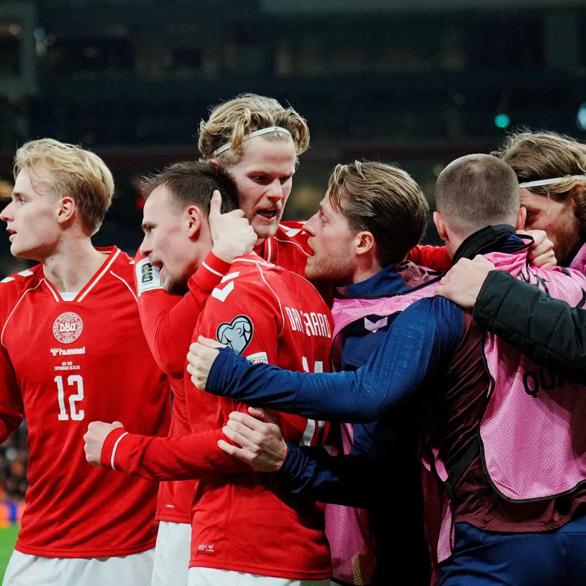 Soccer Football - FIFA World Cup - UEFA Qualifiers - Semi Final - Denmark v North Macedonia - Parken, Copenhagen, Denmark - March 26, 2026 Denmark's Mikkel Damsgaard celebrates scoring their first goal with teammates Liselotte Sabroe/Ritzau Scanpix via REUTERS     ATTENTION EDITORS - THIS IMAGE WAS PROVIDED BY A THIRD PARTY. DENMARK OUT. NO COMMERCIAL OR EDITORIAL SALES IN DENMARK.