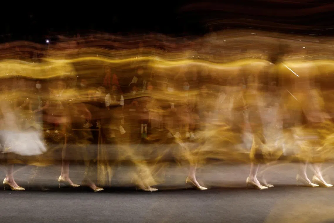 Models present creations at the LOOLAYY Autumn/Winter 2023 collection show by Xiaoqi Zhang, during China Fashion Week in Beijing, China March 30.