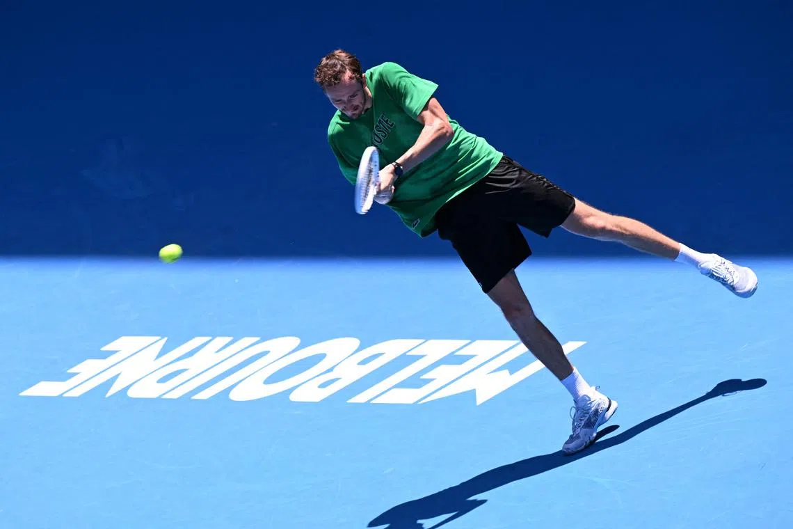 Russia's Daniil Medvedev hits a return during a practice session ahead of the Australian Open tennis tournament in Melbourne on January 11, 2025. (Photo by WILLIAM WEST / AFP) / -- IMAGE RESTRICTED TO EDITORIAL USE - STRICTLY NO COMMERCIAL USE --