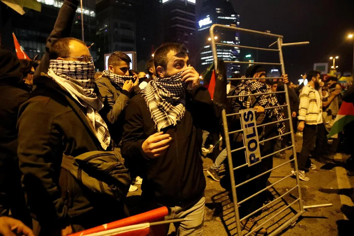 Pro-Palestinian demonstrators protest near the Israeli Consulate in Istanbul, Turkey.