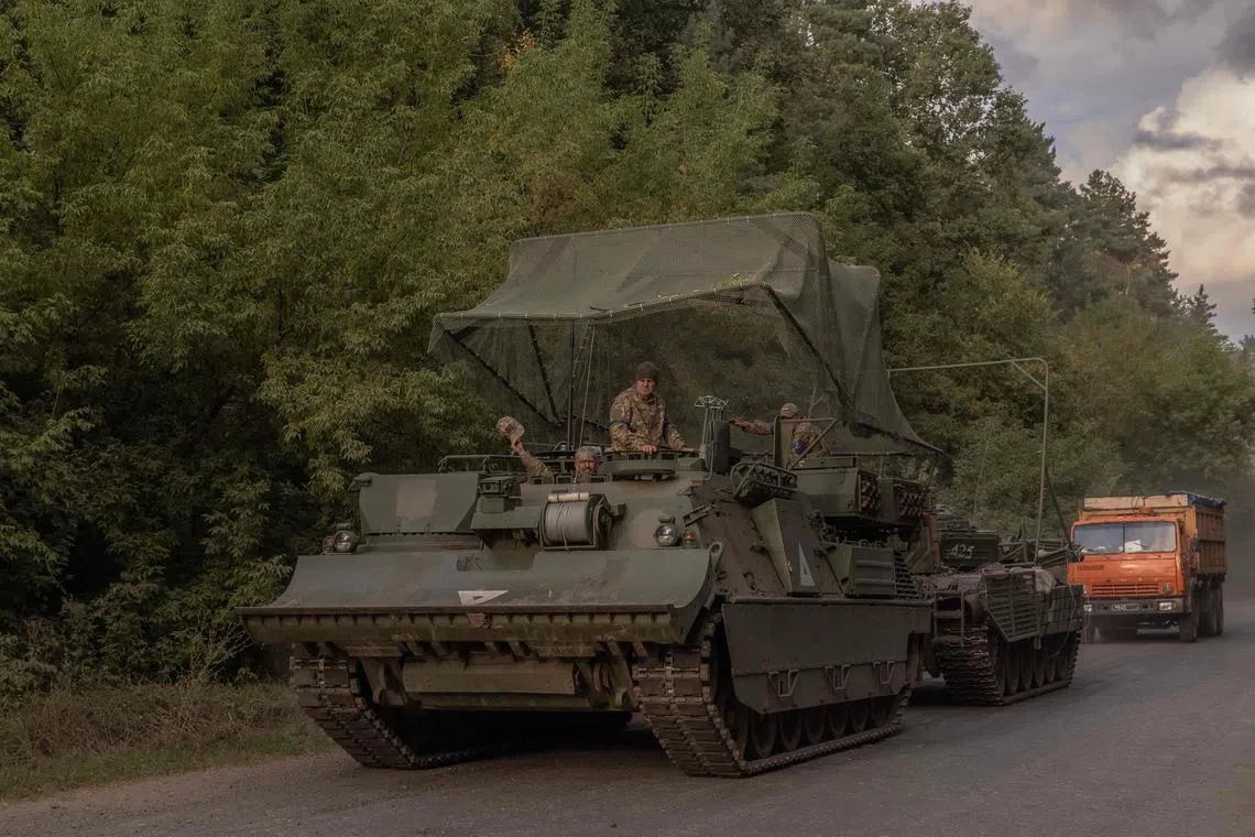 Ukrainian servicemen operate an armoured military vehicle in the Sumy region, near the border with Russia, on August 13, 2024, amid the Russian invasion of Ukraine. Ukraine launched a surprise offensive into the Russian border region of Kursk on August 6, 2024, capturing over two dozen towns and villages in the most significant cross-border attack on Russian soil since World War II. Ukraine's military chief Oleksandr Syrsky told President Volodymyr Zelensky in a video posted on August 12, 2024 that his troops now control about 1,000 square kilometres of Russian territory and are continuing "offensive operations". (Photo by Roman PILIPEY / AFP)
