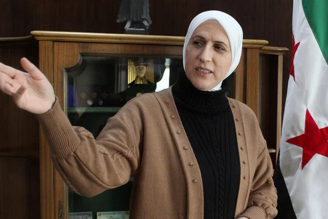 Syria's new central bank governor Maysaa Sabreen gestures at her office in the central bank in Damascus,Syria, January 12, 2025. REUTERS/Firas Makdesi