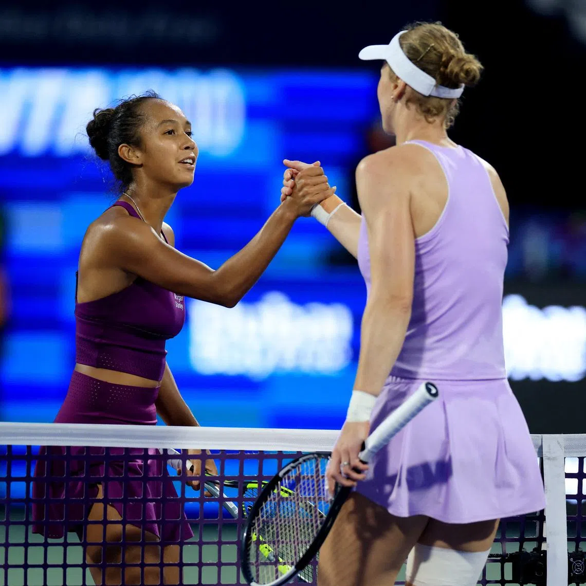 Tennis - WTA 1000 - Dubai Championships - Dubai Tennis Stadium, Dubai, United Arab Emirates - February 15, 2026 Canada's Leylah Fernandez shakes hands with Russia's Liudmila Samsonova after winning her round of 64 match REUTERS/Raghed Waked