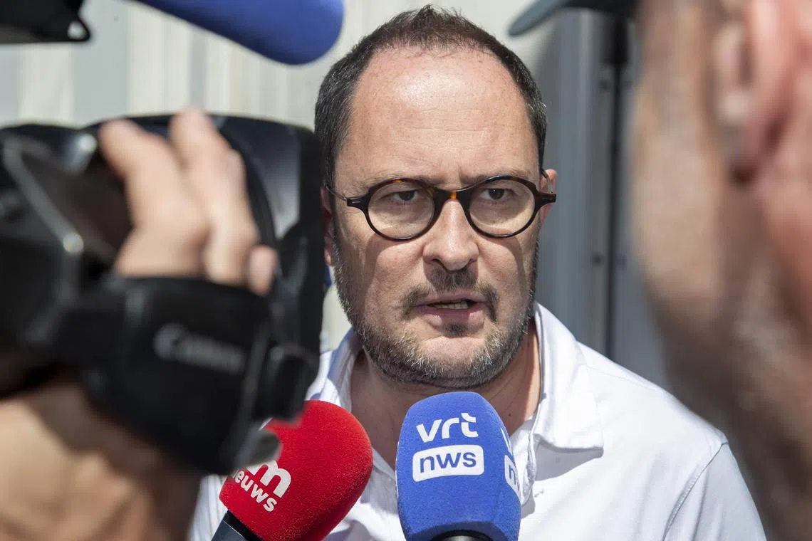 Belgium's Justice Minister Vincent Van Quickenborne speaks to the press at the arrival for a Minister's Kern meeting of the Federal Government, in Brussels, on June 24, 2023. The kern meeting continue the conclave on the budget reform. (Photo by NICOLAS MAETERLINCK / Belga / AFP) / Belgium OUT