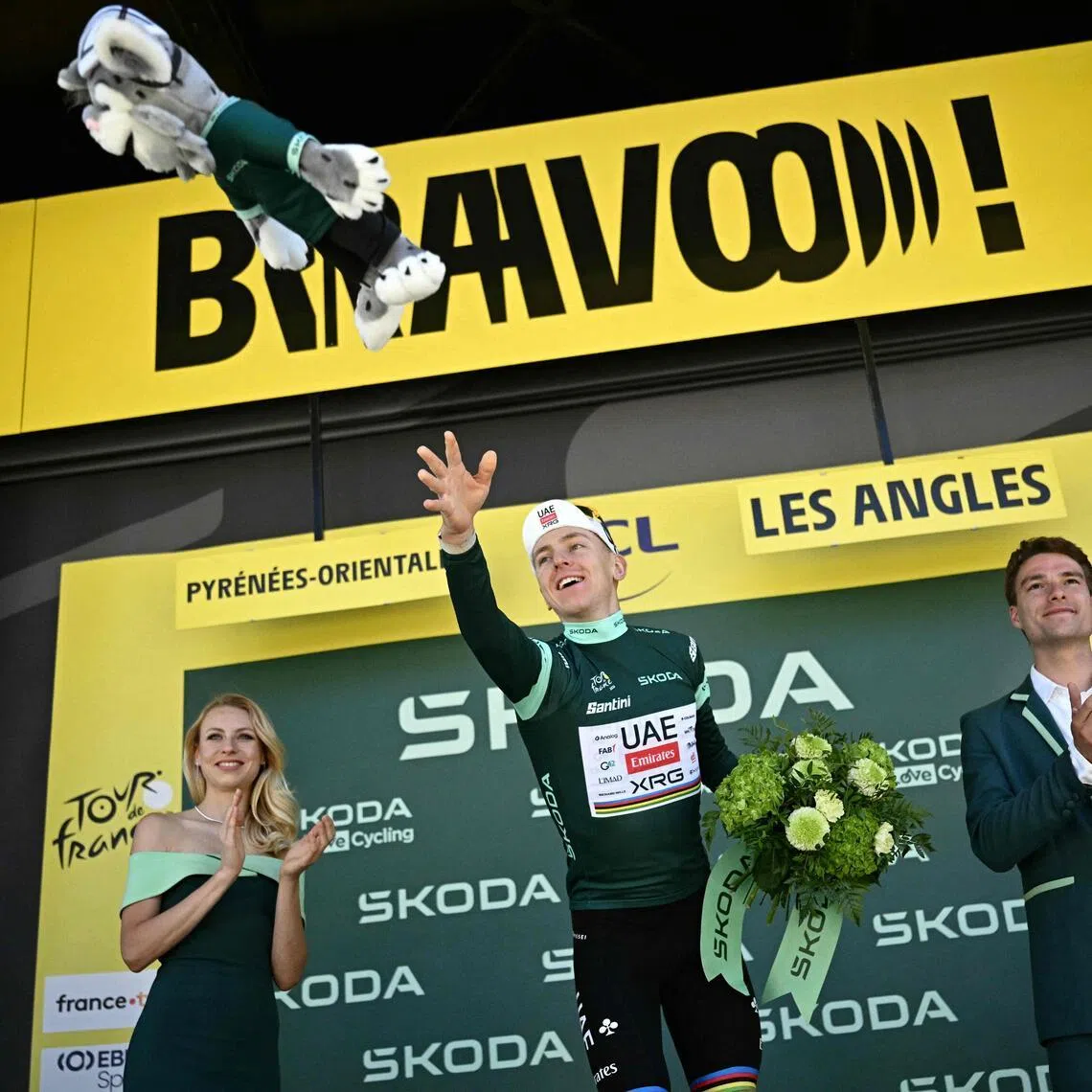 UAE Team Emirates - XRG's Slovenian rider Tadej Pogacar celebrates on the podium with the best sprinter's green jersey after the 3rd stage of the 113th edition of the Tour de France cycling race, 196 km between Granollers and Les Angles in southern France, on July 6, 2026. (Photo by Loic VENANCE / AFP)