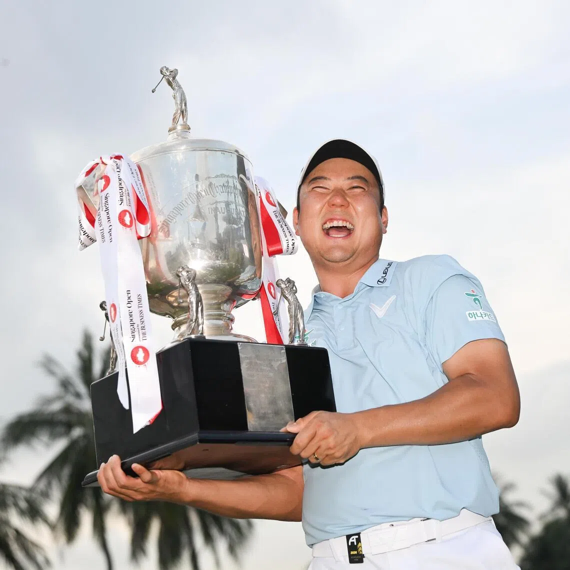 Jeongwoo Ham from South Korea with his trophy after winning the Singapore Open presented by The Business Times at Sentosa Golf Club’s Serapong Course on April 26, 2026. 