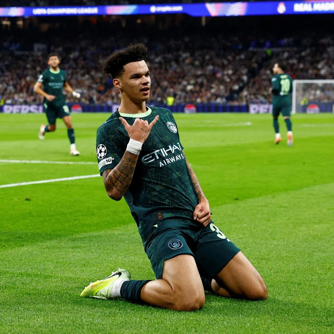 Manchester City's Nico O'Reilly celebrates scoring their first goal.   