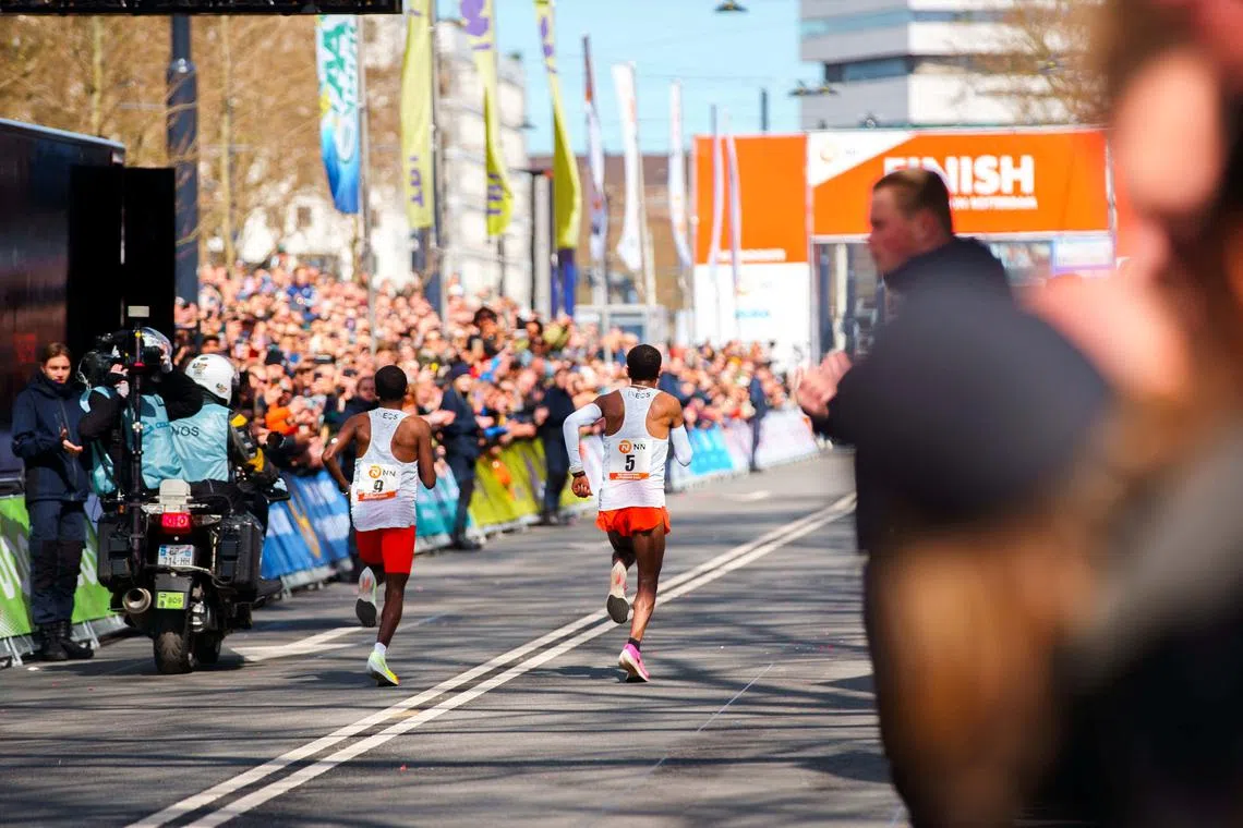 FILE PHOTO: Dutch runner Abdi Nageeye (number 9) wears a CGM (continuous glucose monitor) on his upper left arm as he competes in the 2022 Rotterdam marathon, in Rotterdam, Netherlands, April 2022. NN Running Team/Handout via REUTERS/File Photo