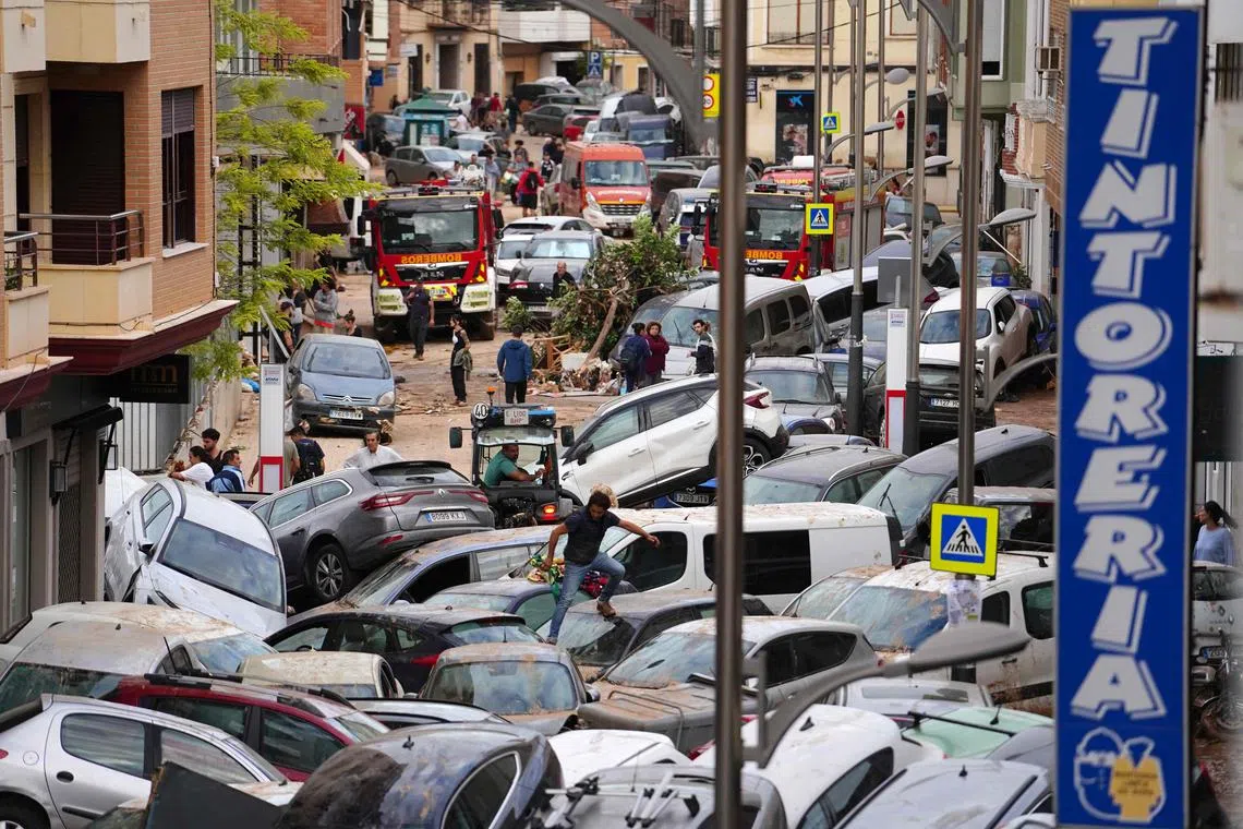 Cars piled up following deadly floods in Sedavi, south of Valencia, eastern Spain, on Oct 31, 2024. 